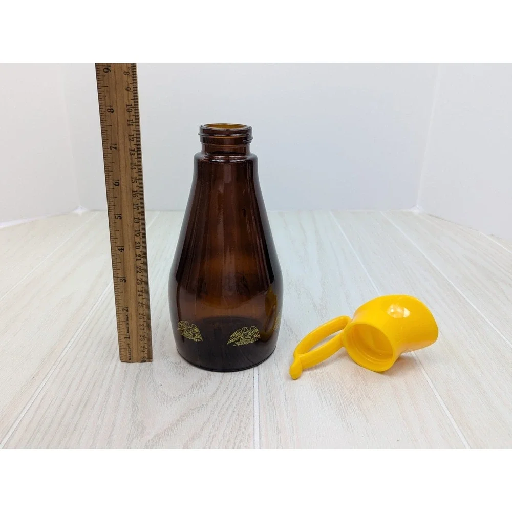 Log Cabin vintage syrup dispenser pitcher amber glass yellow lid patriotic eagle